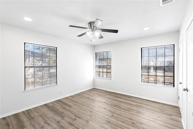 unfurnished room featuring hardwood / wood-style flooring and ceiling fan