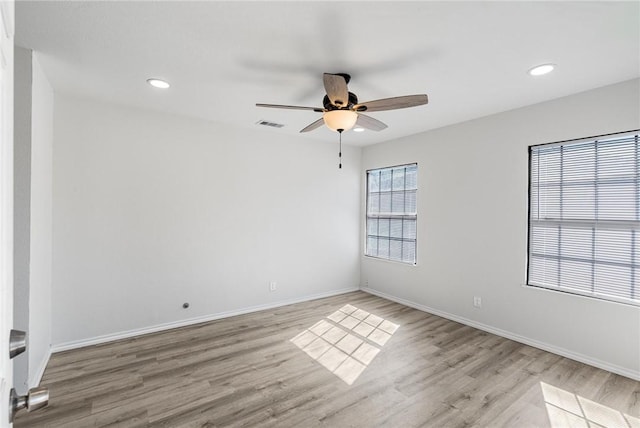 empty room featuring light hardwood / wood-style floors and ceiling fan