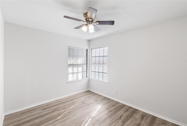 empty room featuring ceiling fan and light hardwood / wood-style flooring