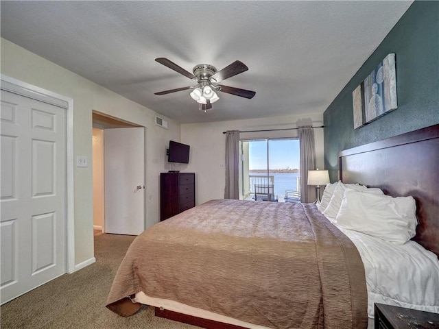 carpeted bedroom featuring a ceiling fan