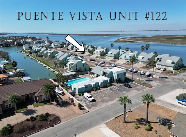 bird's eye view featuring a water view and a residential view