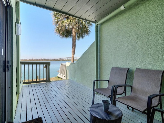 deck featuring a water view