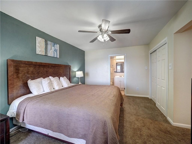 carpeted bedroom featuring ceiling fan, baseboards, a closet, and ensuite bathroom