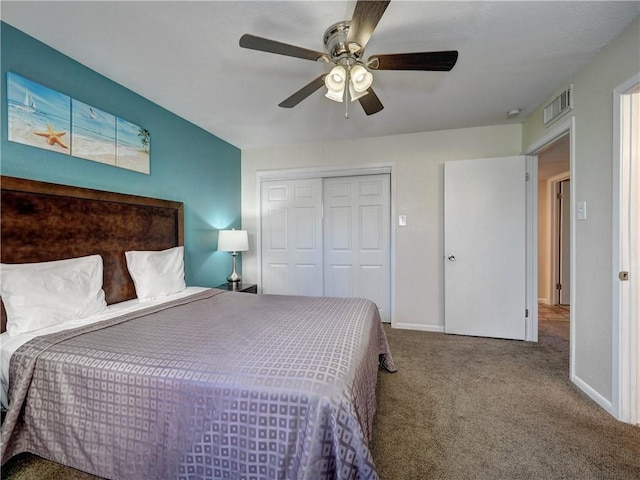 bedroom featuring baseboards, visible vents, a ceiling fan, carpet floors, and a closet