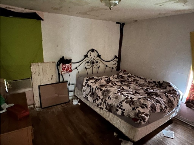 bedroom featuring dark wood-type flooring