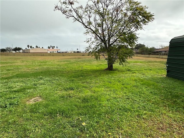 view of yard with a rural view