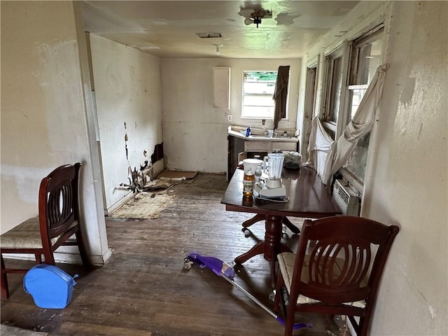 miscellaneous room with hardwood / wood-style flooring and cooling unit