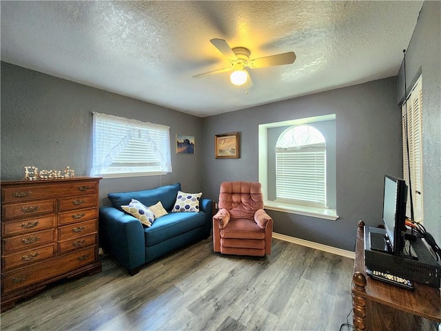 2742 Bramblebush Dr, Corpus Christi, TX 78410 - sitting room with wood finished floors, healthy amount of natural light, ceiling fan, and a textured ceiling