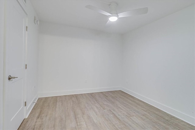 empty room with ceiling fan and light wood-type flooring