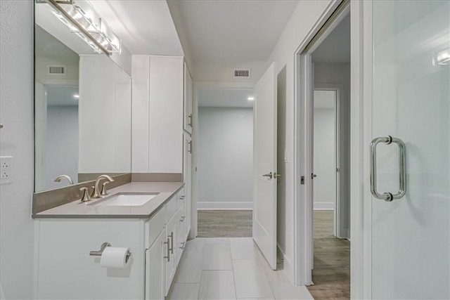 bathroom featuring hardwood / wood-style floors and vanity