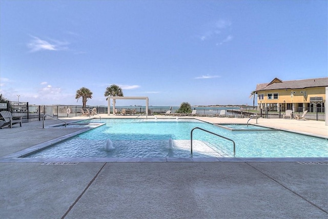 view of swimming pool featuring a patio area and pool water feature