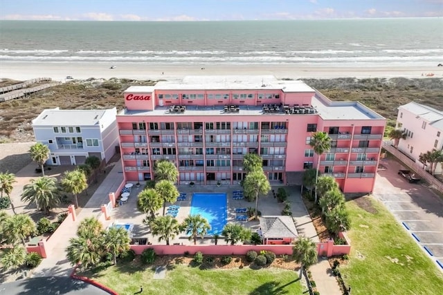 aerial view with a water view and a view of the beach