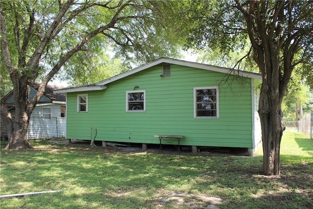 rear view of house with a lawn