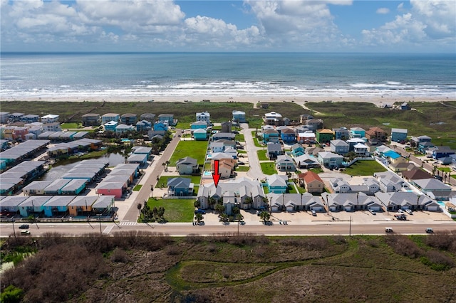 drone / aerial view with a view of the beach and a water view