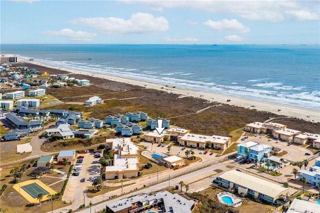 drone / aerial view featuring a water view and a beach view