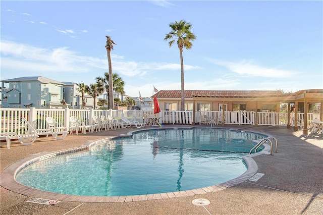 view of swimming pool featuring a patio area