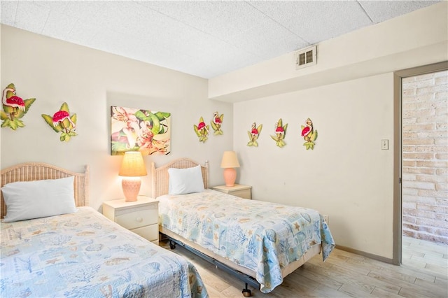 bedroom with light hardwood / wood-style floors