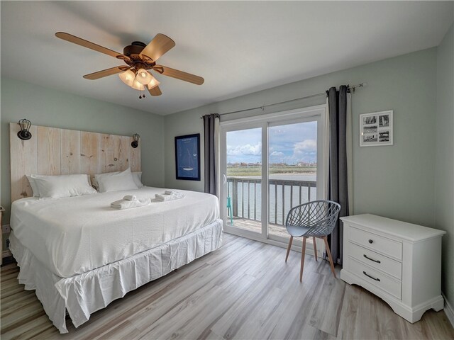 bedroom with access to exterior, light hardwood / wood-style floors, and ceiling fan