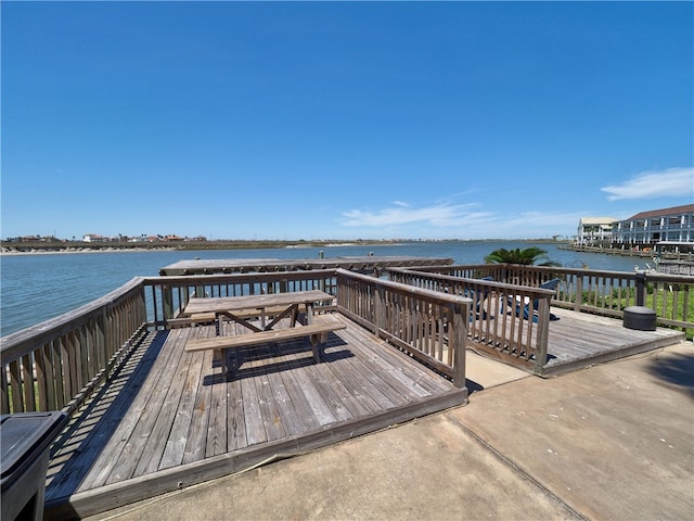 view of dock featuring a deck with water view