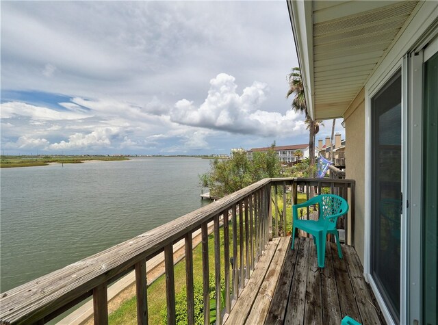 balcony featuring a water view