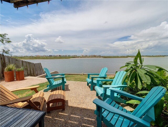 view of patio featuring a water view