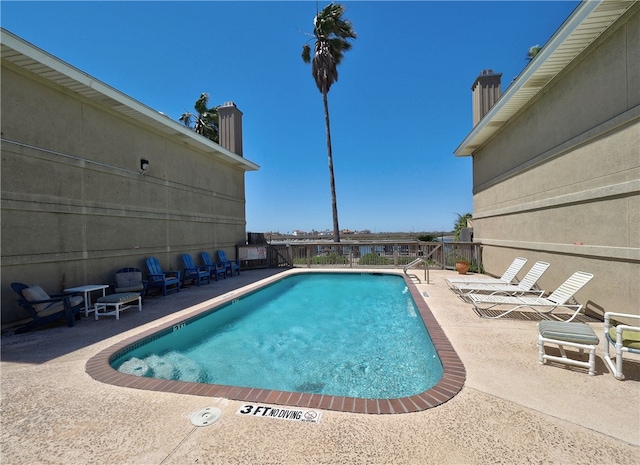 view of pool featuring a patio