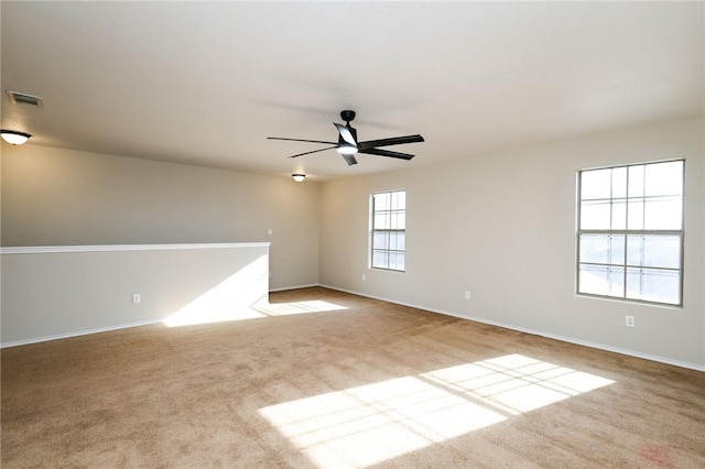 carpeted empty room with ceiling fan