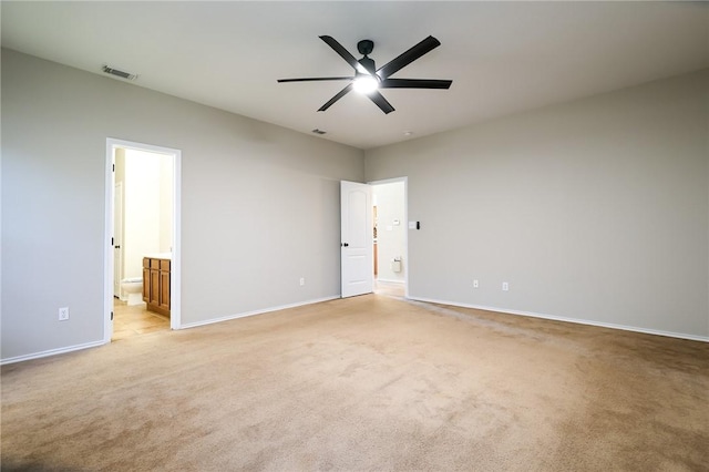 empty room with light colored carpet and ceiling fan