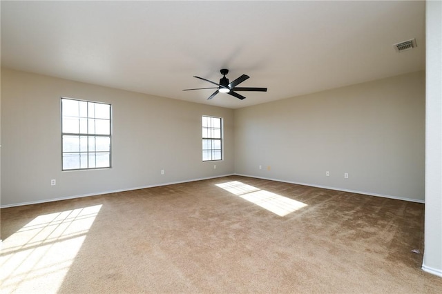 carpeted empty room with ceiling fan