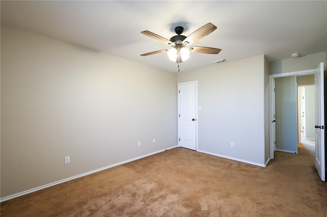 unfurnished bedroom with ceiling fan and carpet floors