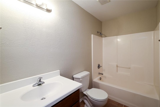 full bathroom featuring vanity, tub / shower combination, and toilet