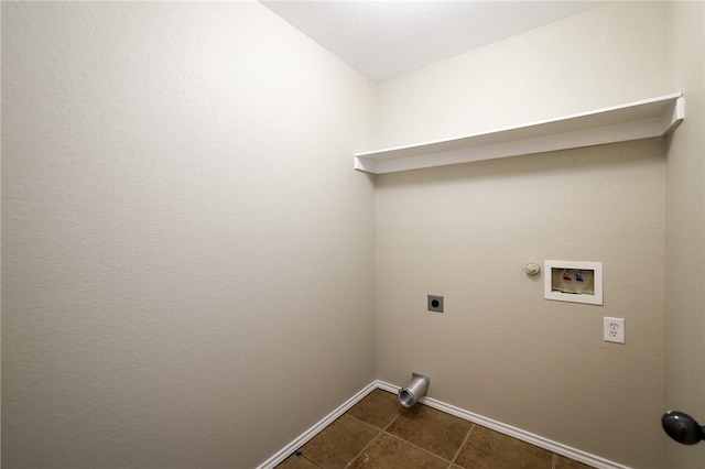 washroom with gas dryer hookup, hookup for an electric dryer, dark tile patterned flooring, and hookup for a washing machine