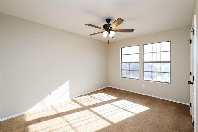 empty room with carpet floors and ceiling fan