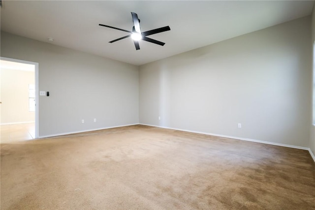 spare room with carpet floors and ceiling fan