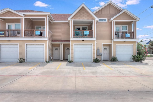 townhome / multi-family property featuring a garage and a balcony