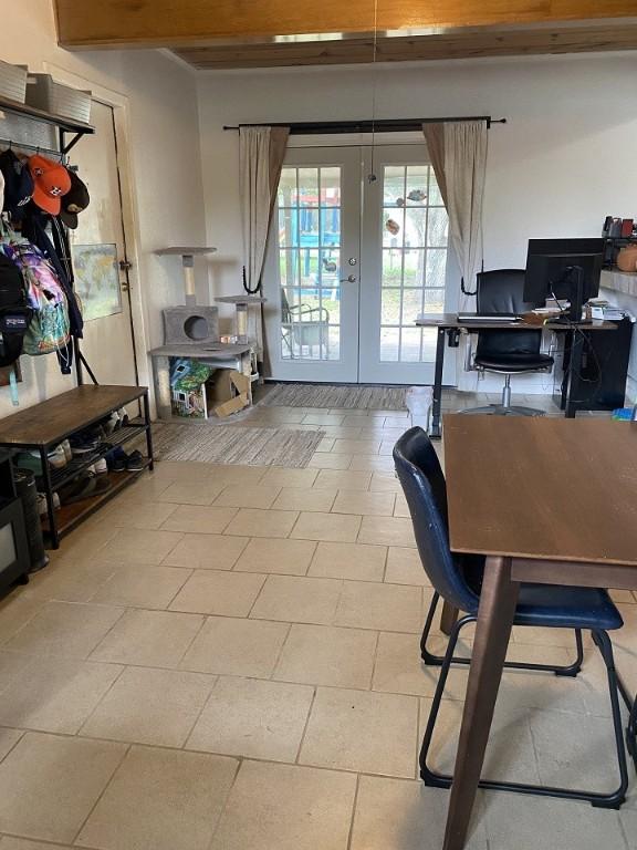 doorway to outside with french doors and a desk