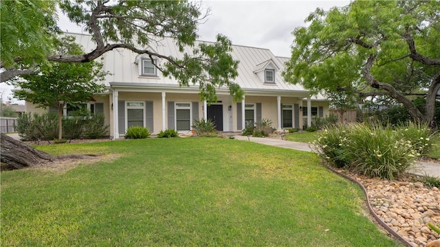 110 Amistad St, Corpus Christi, TX 78404 - view of front facade featuring metal roof, a standing seam roof, and covered porch