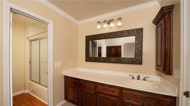 110 Amistad St, Corpus Christi, TX 78404 - full bath with vanity, crown molding, shower / bath combination with glass door, and wood finished floors