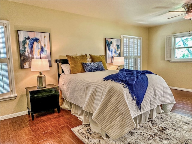 bedroom featuring ceiling fan and dark hardwood / wood-style floors