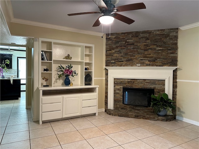 unfurnished living room with built in shelves, ceiling fan, light tile patterned floors, a fireplace, and crown molding