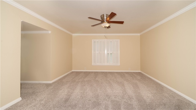 carpeted empty room featuring ornamental molding and ceiling fan