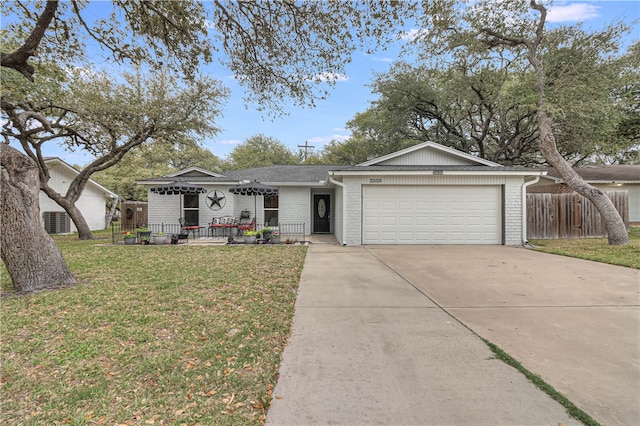 ranch-style house with a garage and a front yard