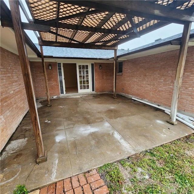 view of patio featuring an attached carport and a pergola