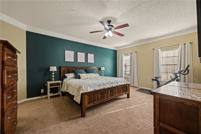 carpeted bedroom with a textured ceiling, ornamental molding, and ceiling fan