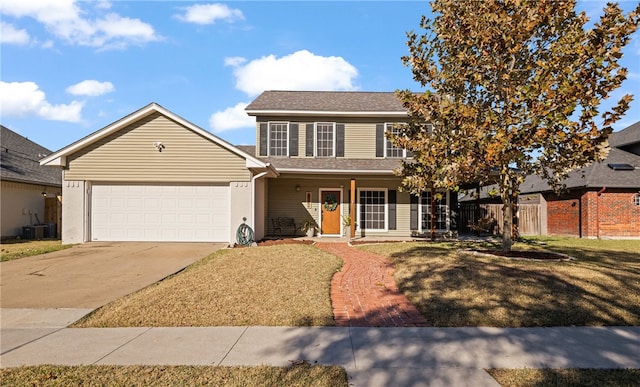 view of front of house featuring a porch, a garage, and a front lawn