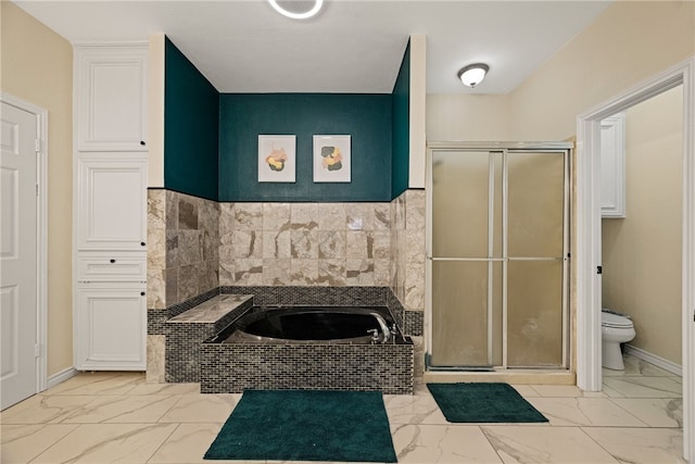 bathroom with toilet and shower with separate bathtub