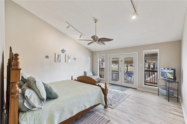 bedroom with light hardwood / wood-style flooring, ceiling fan, french doors, access to outside, and track lighting