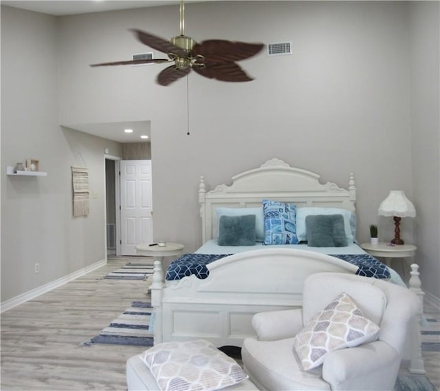 13525 Bullion Ct, Corpus Christi, TX 78418 - bedroom featuring light wood finished floors, a high ceiling, recessed lighting, and a ceiling fan
