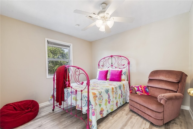 bedroom with ceiling fan and light hardwood / wood-style floors