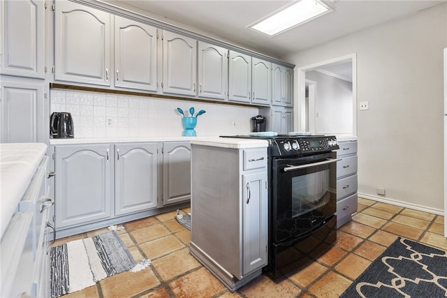 kitchen featuring decorative backsplash, black / electric stove, and gray cabinets